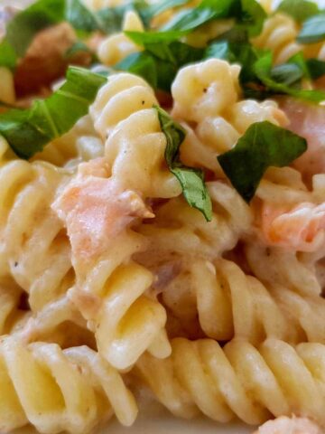 Salmon and creme fraiche pasta with basil.