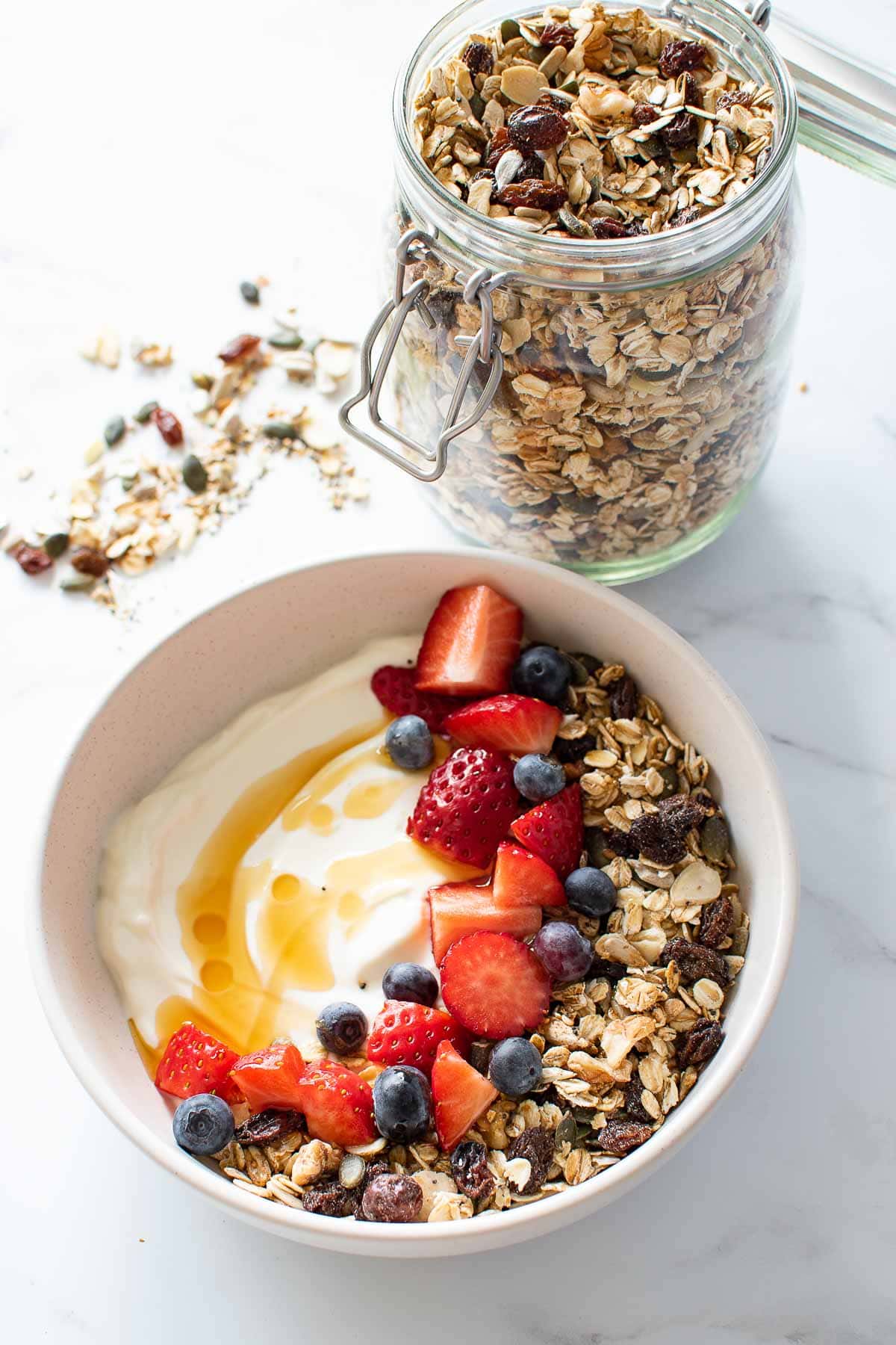 A yogurt bowl with muesli and berries.