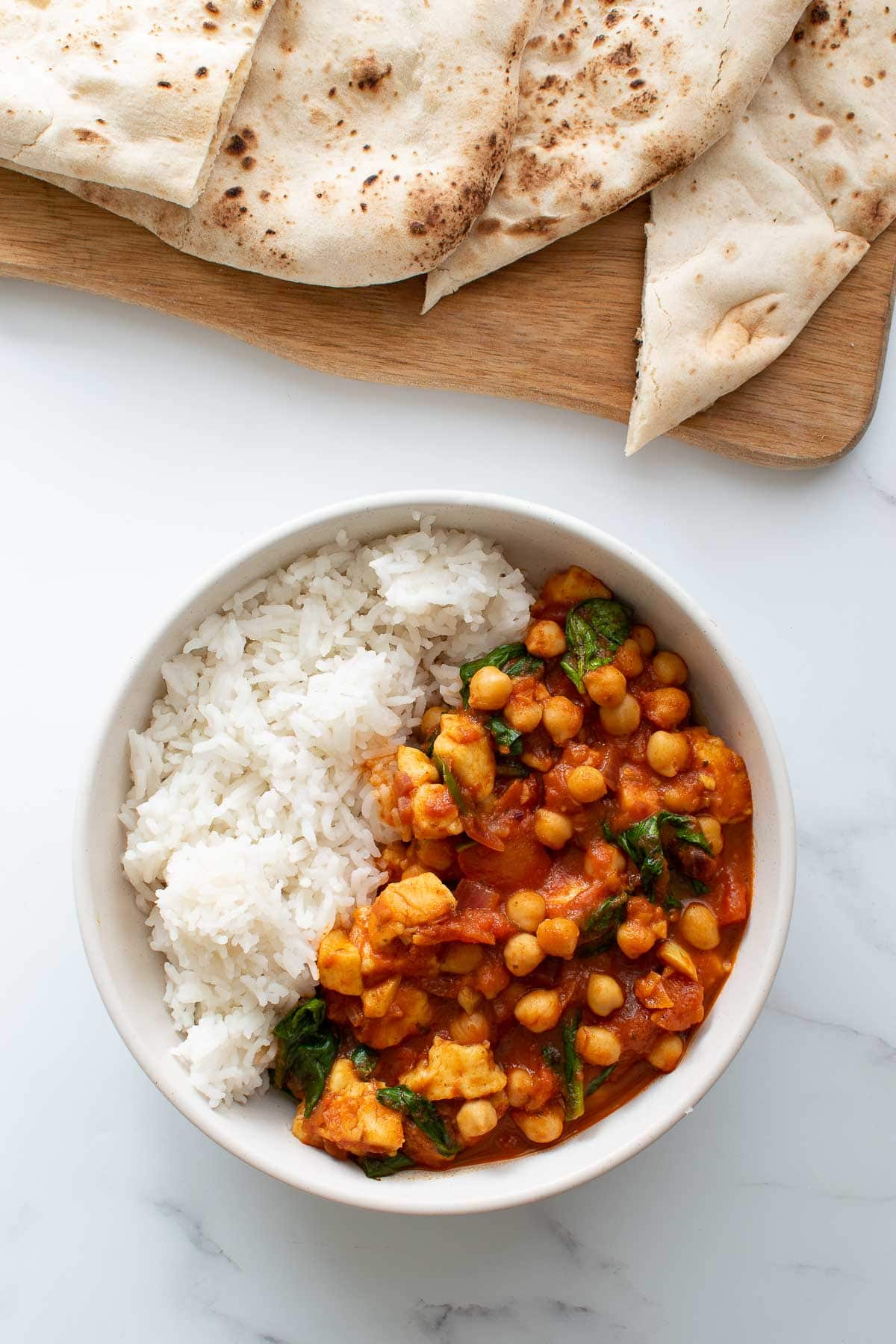 Chickpea, halloumi and spinach curry with rice.