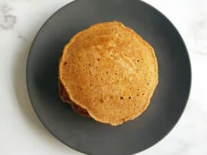Gingerbread flavored pancake on a plate.