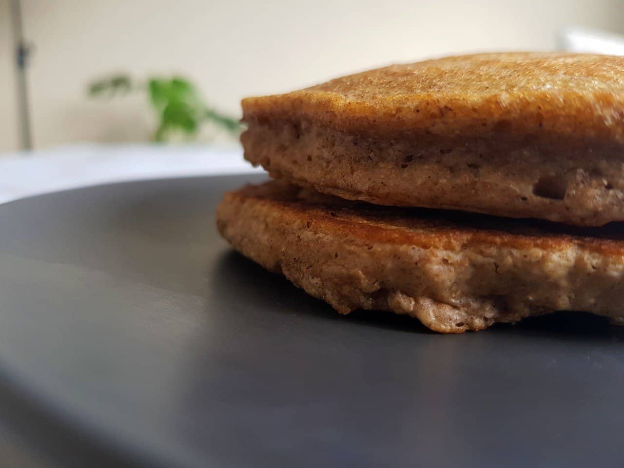 Stack of healthy gingerbread pancakes on a plate.