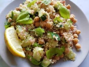 Tuna bulgur salad with chickpeas and cucumber on a plate ready to serve.