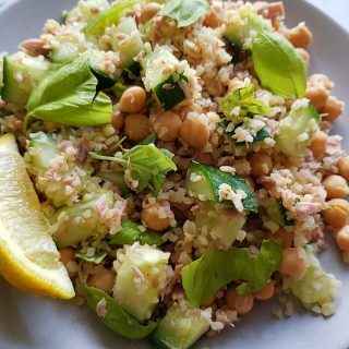 Tuna bulgur salad with chickpeas and cucumber on a plate ready to serve.