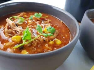 Chicken taco soup in gray bowls.