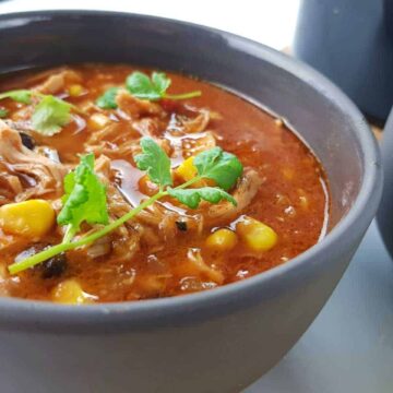 Chicken taco soup in gray bowls.