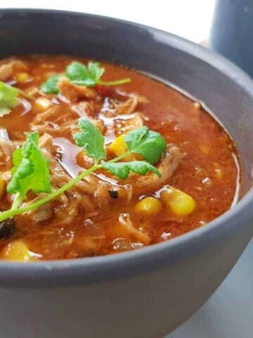 Chicken taco soup in gray bowls.