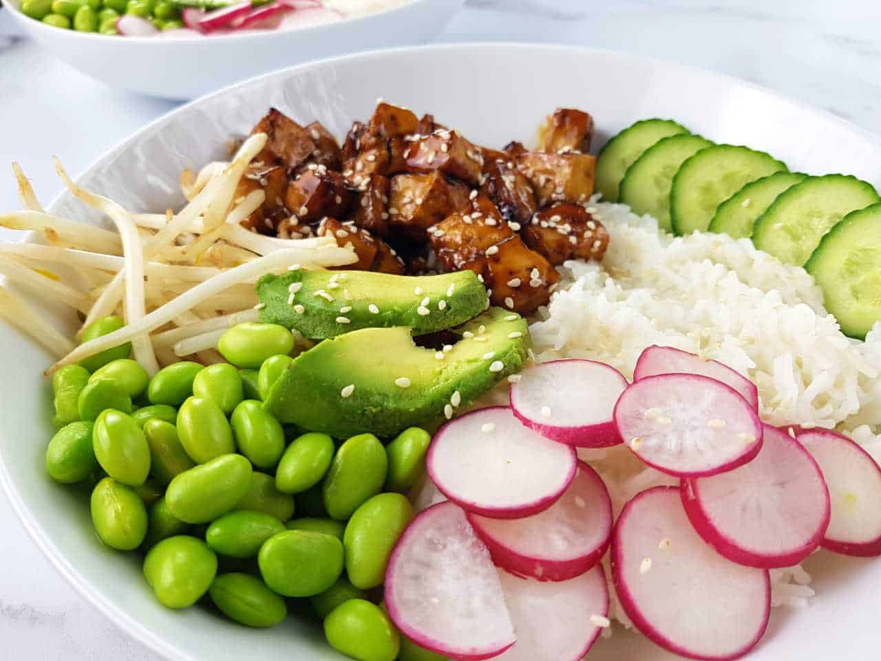 Teriyaki tofu bowl on a marble table.