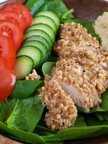 walnut coated chicken with salad.