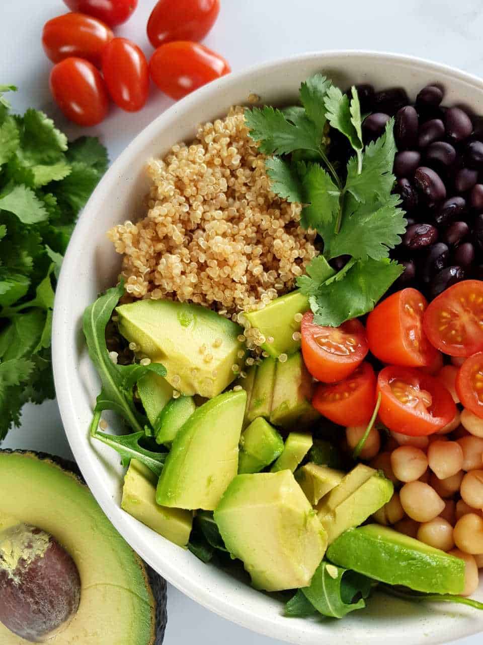 Black bean and quinoa salad with avocado in a bowl.