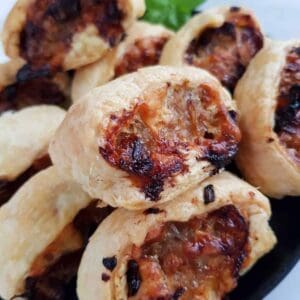 sausage rolls with cheese and onions.