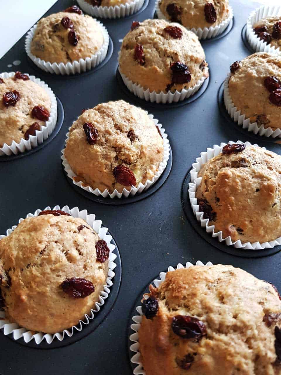 Healthy banana oat muffins on a baking tray.