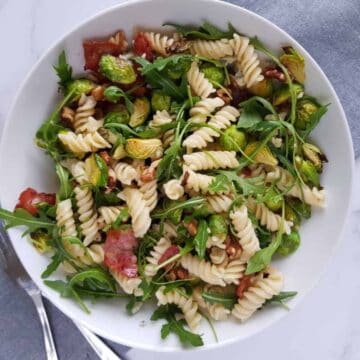 pasta salad with arugula, brussels sprouts and bacon.