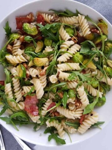 pasta salad with arugula, brussels sprouts and bacon.