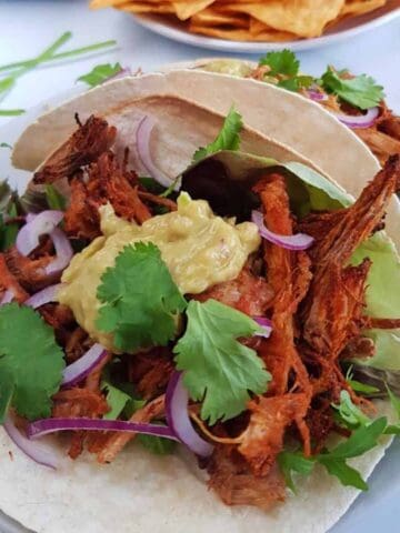 crispy pork carnitas with guacamole.