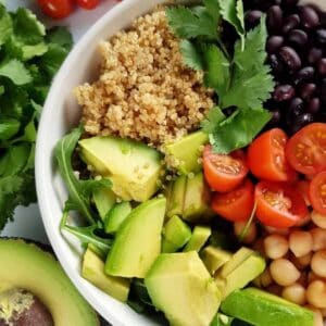 a bowl of mixed quinoa avocado salad.