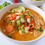 chicken noodle soup with thai flavors in a bowl.