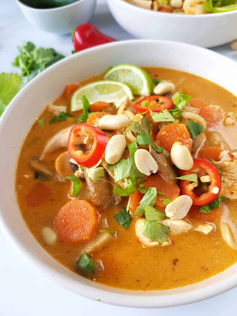 Thai coconut ramen in a white bowl.