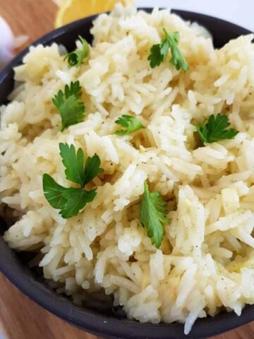 a bowl of basmati rice with lemon and garlic.