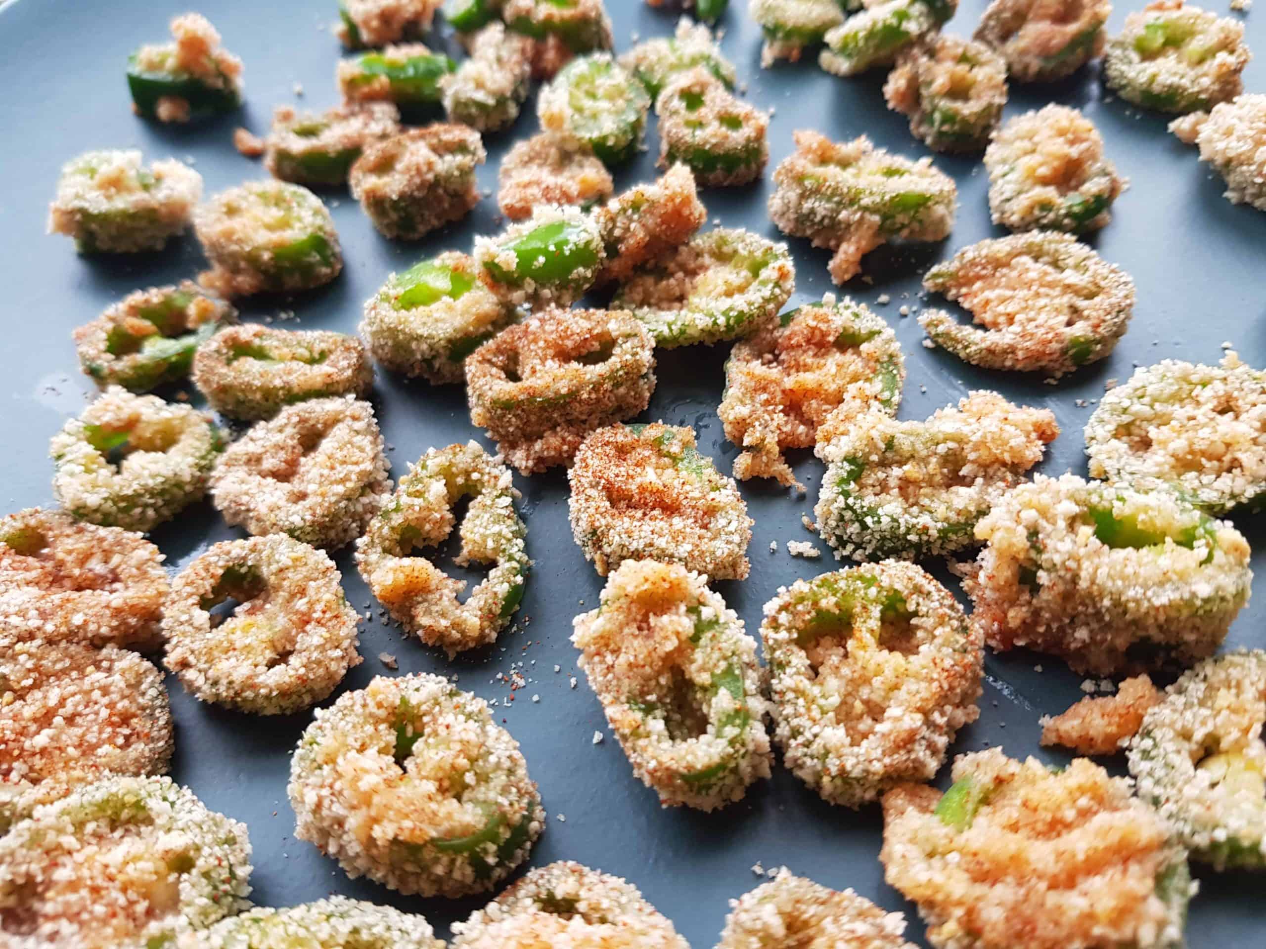 Breaded jalapenos ready to be fried.