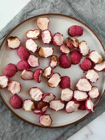 Roasted radishes on a plate.