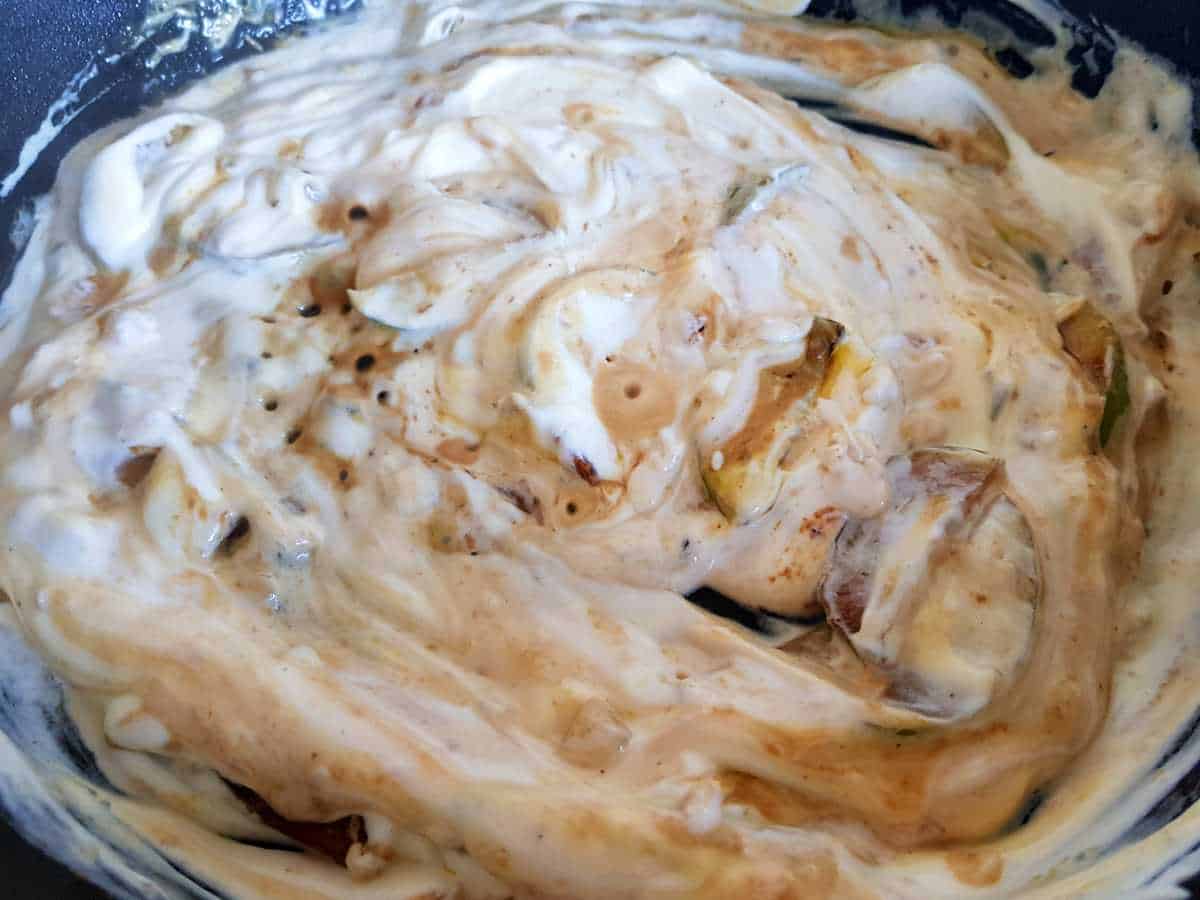 Apple cream sauce cooking in the cast iron skillet.