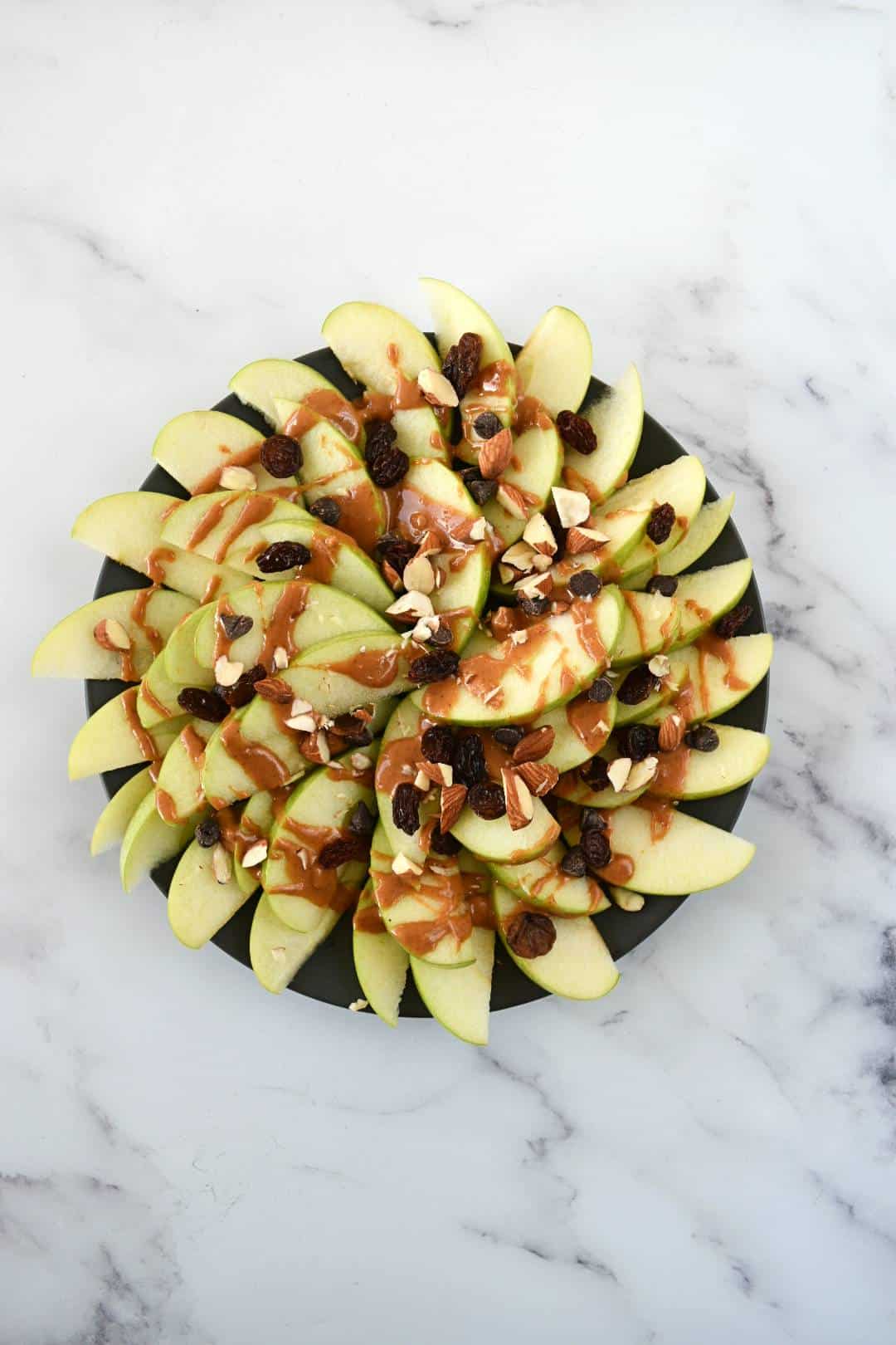 Apple nachos on a plate.