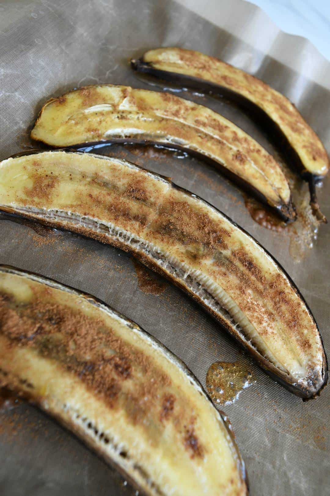 Baked bananas on a baking tray.