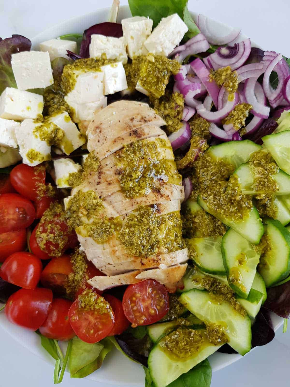 Chicken salad with pesto in a bowl.