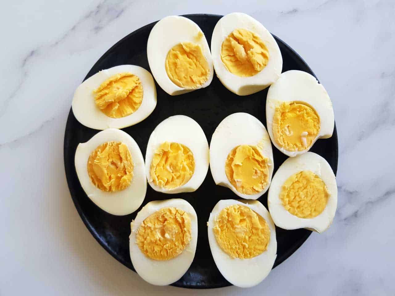 Hard boiled eggs on a plate.