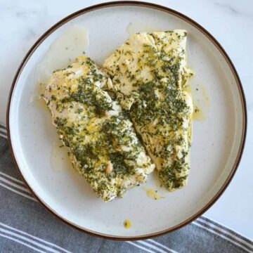 Lemon butter cod on a plate.