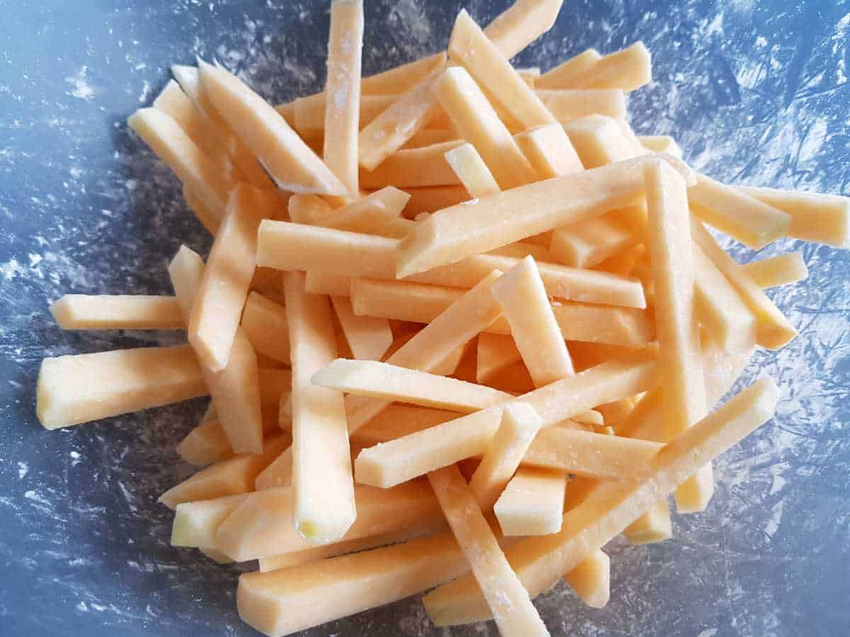 Raw rutabaga fries covered with cornstarch.