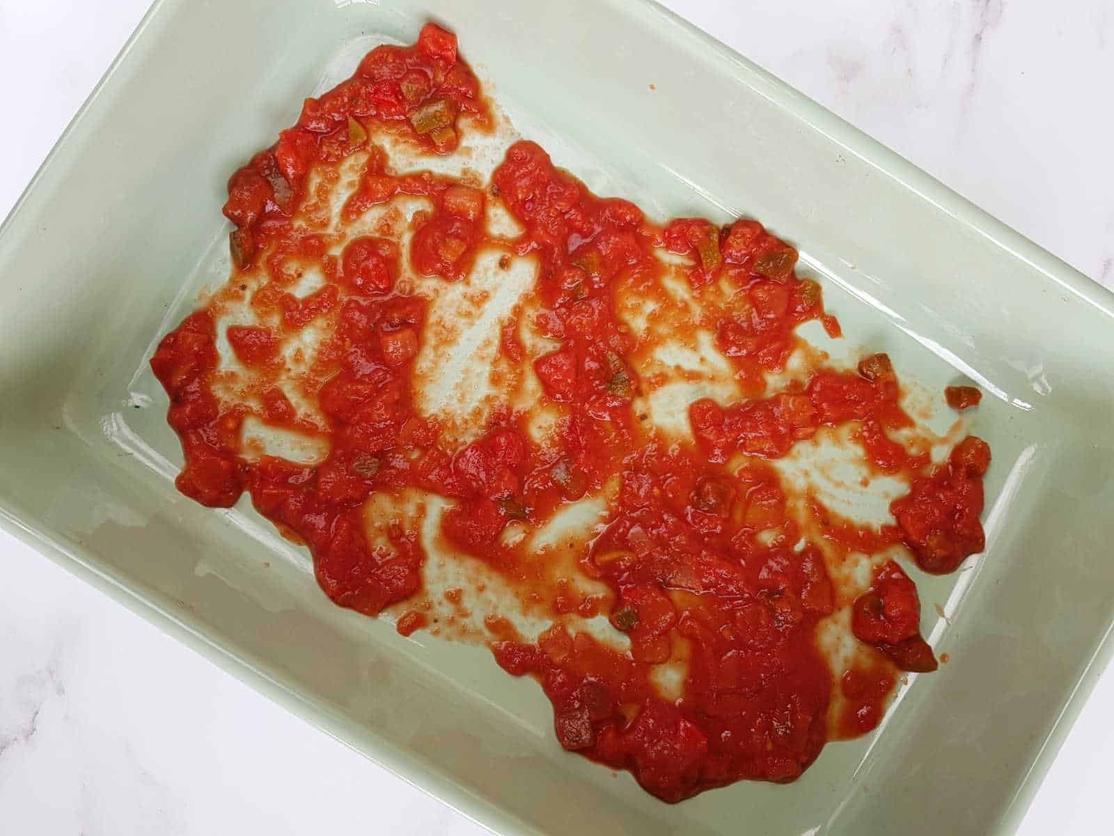 Salsa in a casserole dish.