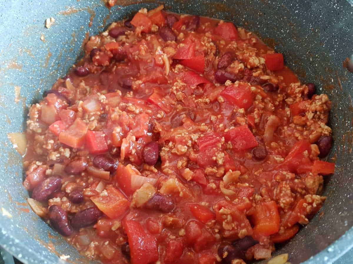 Turkey chili cooking in a pot.