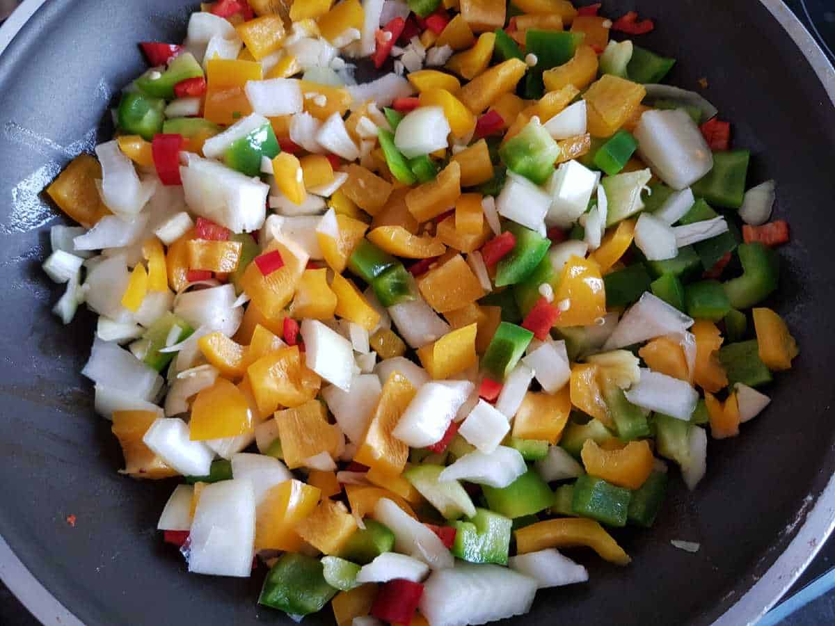 Vegetables in a pan sauteeing.