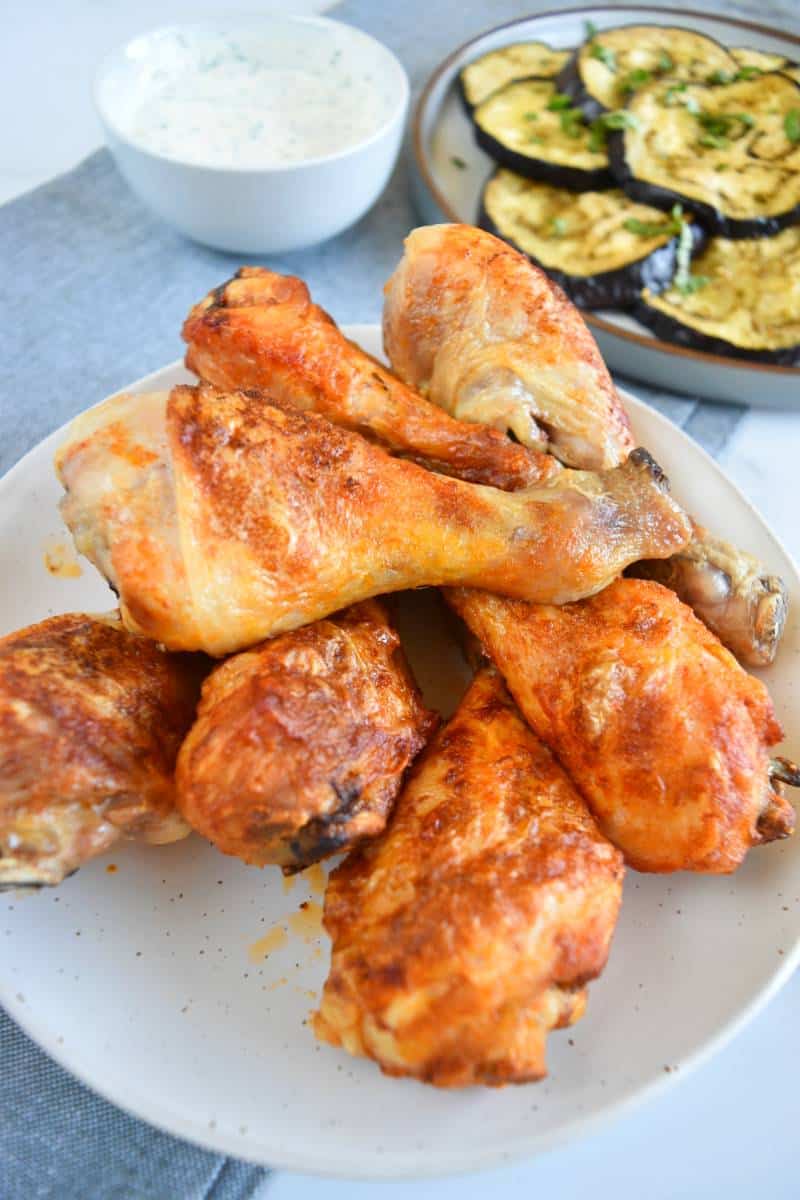 Air fryer buffalo chicken legs on a plate.