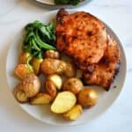Air fryer pork chops with potatoes.