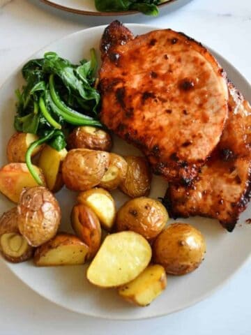 Air fryer pork chops with potatoes.