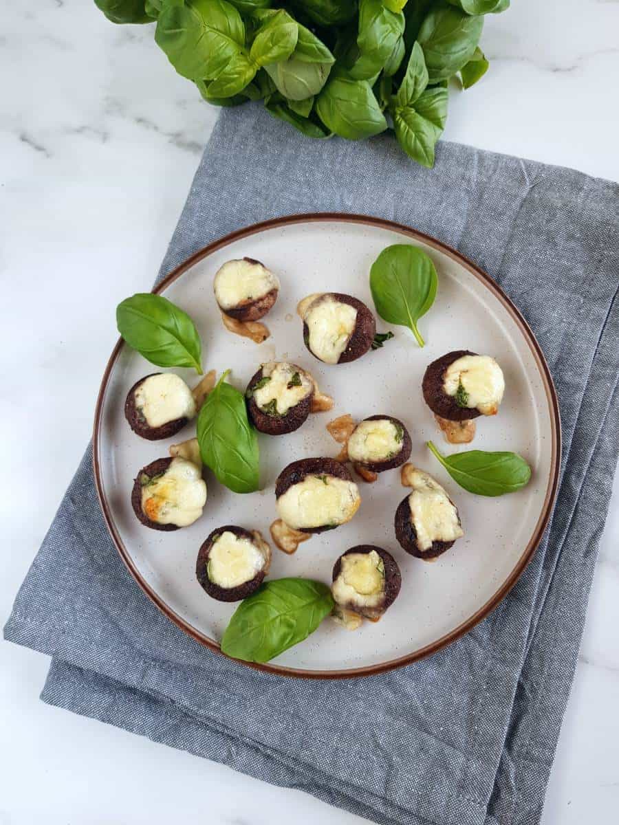 Baked stuffed mushrooms on a plate.