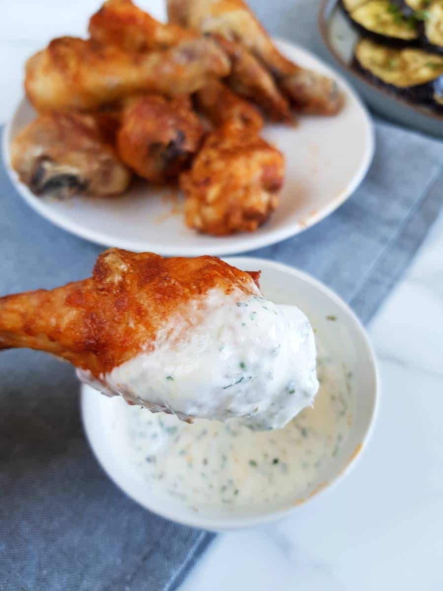 Buffalo chicken legs with ranch sauce.