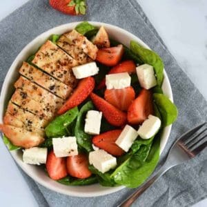 Chicken and strawberry salad with feta and spinach.