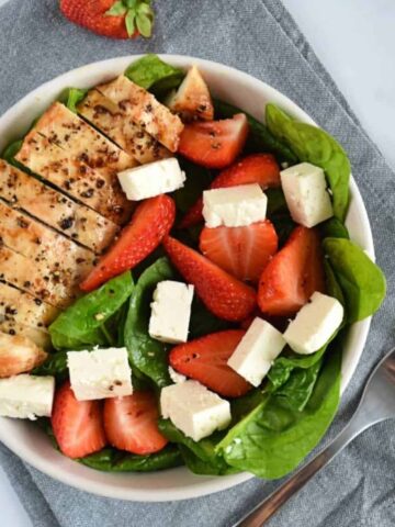 Chicken and strawberry salad with feta and spinach.