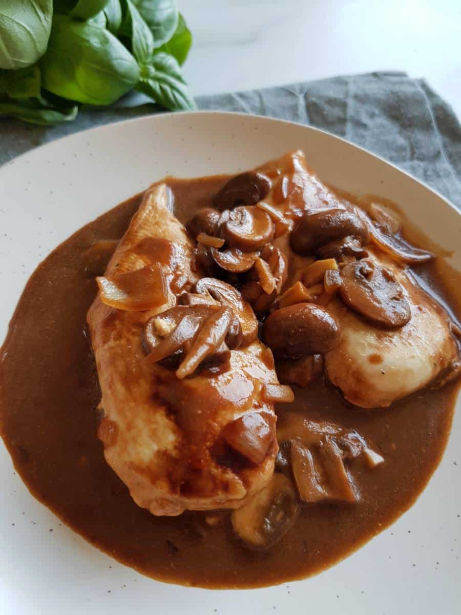 Marsala chicken with mushrooms on a plate.