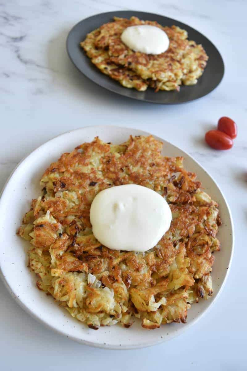 Draniki potato pancakes with sour cream.