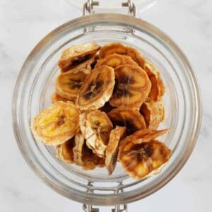 Dried banana slices in a jar.