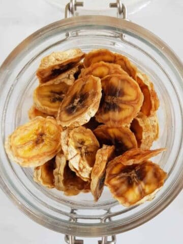 Dried banana slices in a jar.