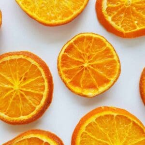 Dried orange slices on a marble table.