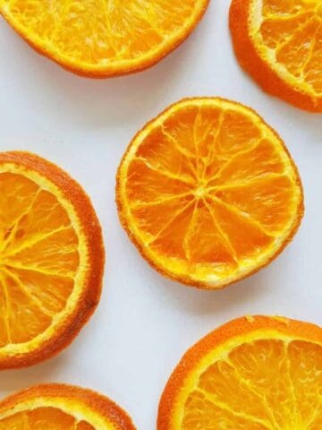 Dried orange slices on a marble table.