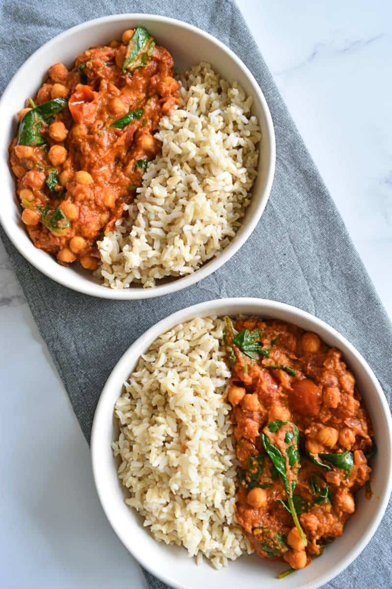 Hummus curry in bowls with rice.