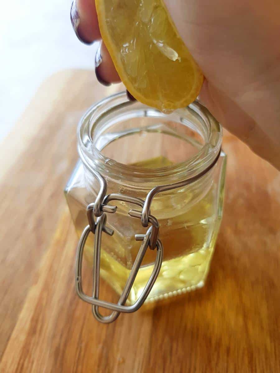 Making lemon pepper vinaigrette in a jar.