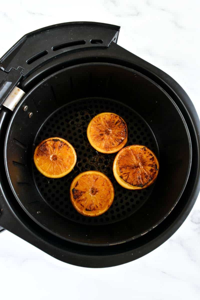 Roasted halved oranges in an air fryer.